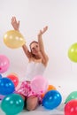 Funny cute little girl with baloons Royalty Free Stock Photo