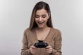 Funny cute woman holing joystick playing new video game