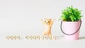 Funny dancing toy cat next to a bucket with a and the inscription good morning. Good morning wish concept for child or adult. copy