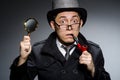 Funny detective with pipe Royalty Free Stock Photo