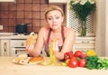 Funny dieting woman housewife choosing between healthy food and