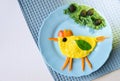 Funny dish for Kids. Omelette with vegetables in shape of chicken. Food art. Restaurant menu. Creative breakfast.