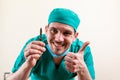 Funny doctor with a scalpel in his hands.