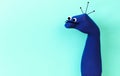Funny doll sock on blue background, hand theater - Image Royalty Free Stock Photo