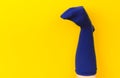 Funny doll sock on yelow background, hand theater - Image Royalty Free Stock Photo