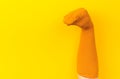 Funny doll sock on yelow background, hand theater - Image Royalty Free Stock Photo