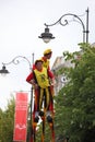 Funny dressed persons on stilts Royalty Free Stock Photo