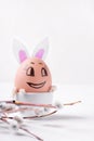 Funny Easter egg reminding cute bunny and willow twig