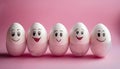 Funny Easter eggs with facial expressions. Eggs with different faces on pink background Royalty Free Stock Photo