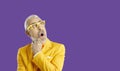 Funny eccentric senior man with amazed and shocked facial expression on banner background. Royalty Free Stock Photo