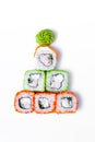 Funny edible Christmas tree made from sushi, creative idea for japanese restaurant on white background. New Year food Royalty Free Stock Photo