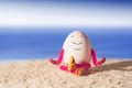 Funny egg girl doing yoga on a beach Royalty Free Stock Photo
