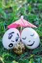 Funny eggs imitate white and mixed couples with versicolored bab Royalty Free Stock Photo