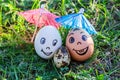 Funny eggs imitating happy mixed parents with versicolored baby