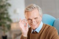 Funny elderly gentleman in glasses grinning broadly into camera Royalty Free Stock Photo