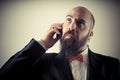 Funny elegant bearded man on the phone