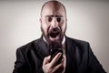 Funny elegant bearded man screaming on the phone Royalty Free Stock Photo