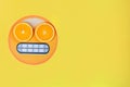 Funny emoji with slices citruses eyes