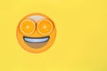 Funny emoji with slices citruses eyes