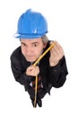 Funny engineer with a measuring tape