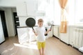 Funny European little boy chef dancing Royalty Free Stock Photo