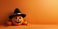 Funny evil pumpkin smiling on orange background