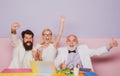 Funny excited business people. Group of joyful excited businesspeople having fun in office, using laptop. Royalty Free Stock Photo