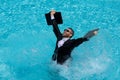 Funny excited businessman in suit with laptop in swimming pool. Crazy business man on summer vacation. Amazed Royalty Free Stock Photo