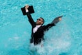 Funny excited businessman in suit with laptop in swimming pool. Crazy business man on summer vacation. Amazed Royalty Free Stock Photo