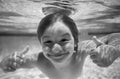 Funny excited kids face under water. Young boy swim and dive underwater. Under water portrait in swim pool. Child boy Royalty Free Stock Photo