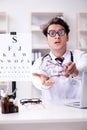 The funny eye doctor in humourous medical concept