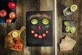 Funny face arranged from linseed, kiwi and strawberry on black s Royalty Free Stock Photo