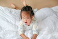 Cute little girl lying on bed at the morning Royalty Free Stock Photo