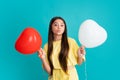 Funny face. Child teenager girl with red balloons on birthday holiday party. Royalty Free Stock Photo