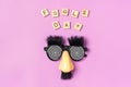 funny face - fake eyeglasses, nose and mustache, confetti, sequins on pink background Happy fools day concept 1st April party Royalty Free Stock Photo