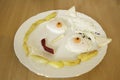 Funny face serving fried eggs Royalty Free Stock Photo