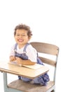 Funny face toddler in a desk Royalty Free Stock Photo