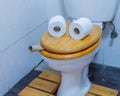 Funny face on a toilet seat humor concept Royalty Free Stock Photo
