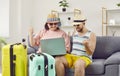 Funny family couple booking cheap tickets to travel to their holiday destination