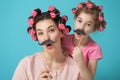 Mother and her daughter with a paper accessories Royalty Free Stock Photo
