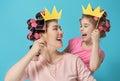 Mother and her daughter with a paper accessories Royalty Free Stock Photo