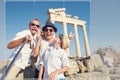 Funny family take a selfie photo on Apollo Temple colonnade view Royalty Free Stock Photo