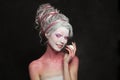 Funny fashion model woman fantasy witch with stage makeup, studio portrait