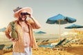 Funny fat bearded man with binoculars on vacation in the beach in summer. Royalty Free Stock Photo