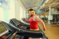 A funny fat man doing exercises in the gym. Royalty Free Stock Photo