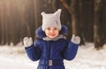 Funny ferret girl in winter on a walk in the woods