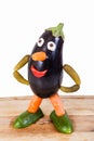 Funny figure carved out of an eggplant Royalty Free Stock Photo