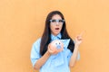 Surprised Woman with Piggy Bank thinking what to Invest in Royalty Free Stock Photo
