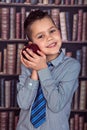 Funny first-grader boy with red apple Royalty Free Stock Photo