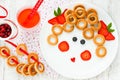 Funny food art idea for healthy baby girl breakfast - bagels wit